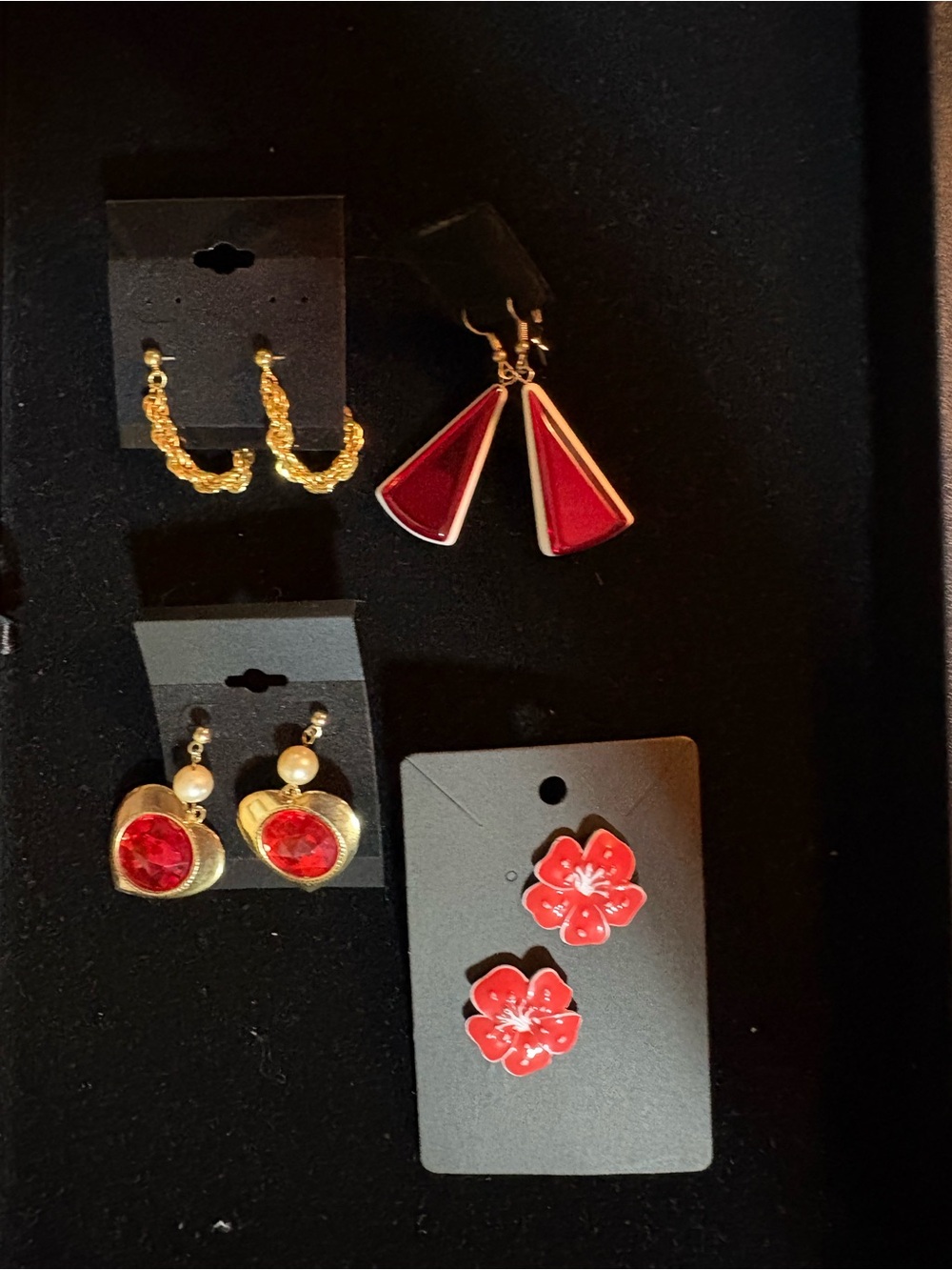Selection of 4 sets of red themed earrings.